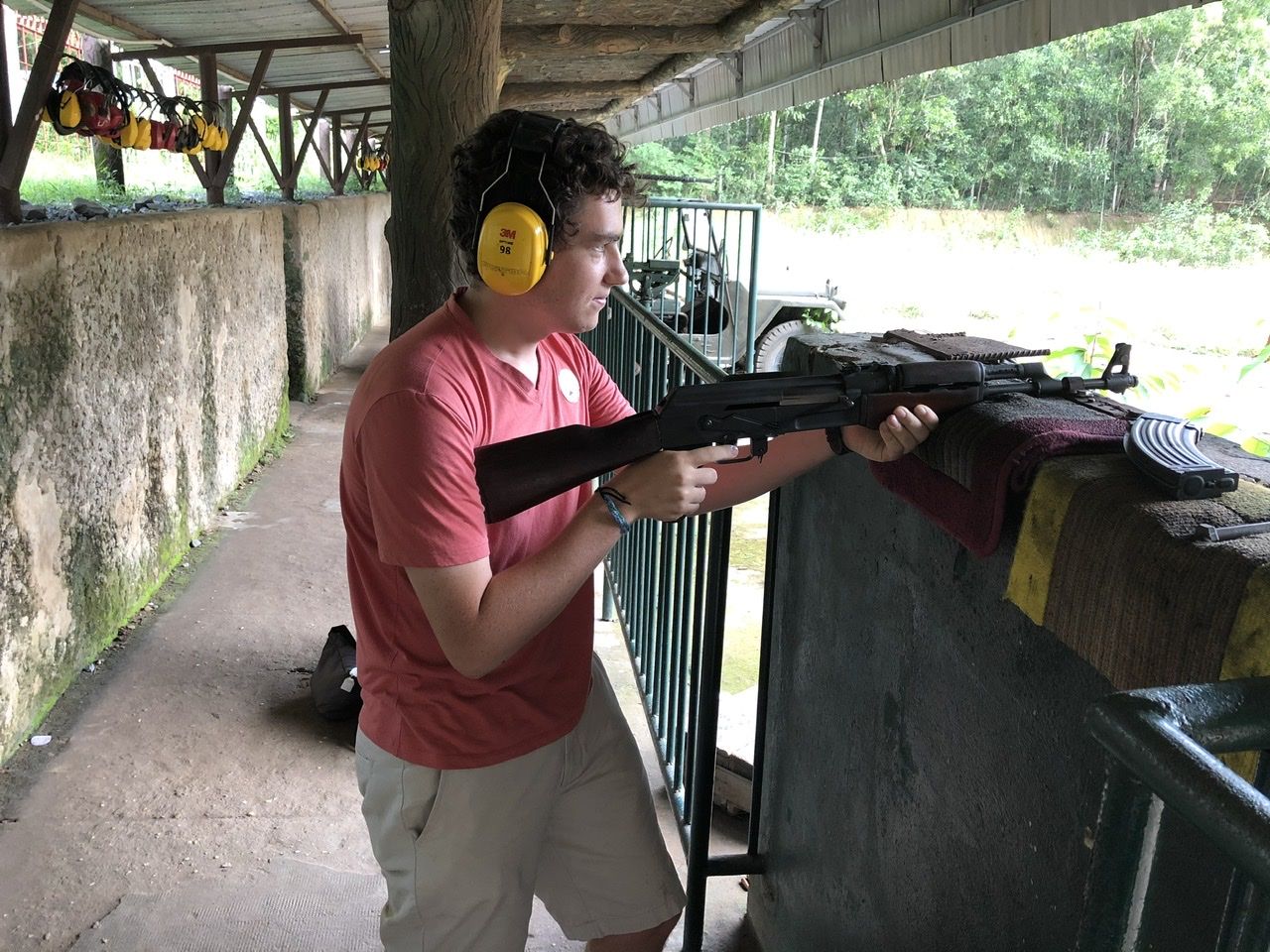Holding an AK47 at the shooting range