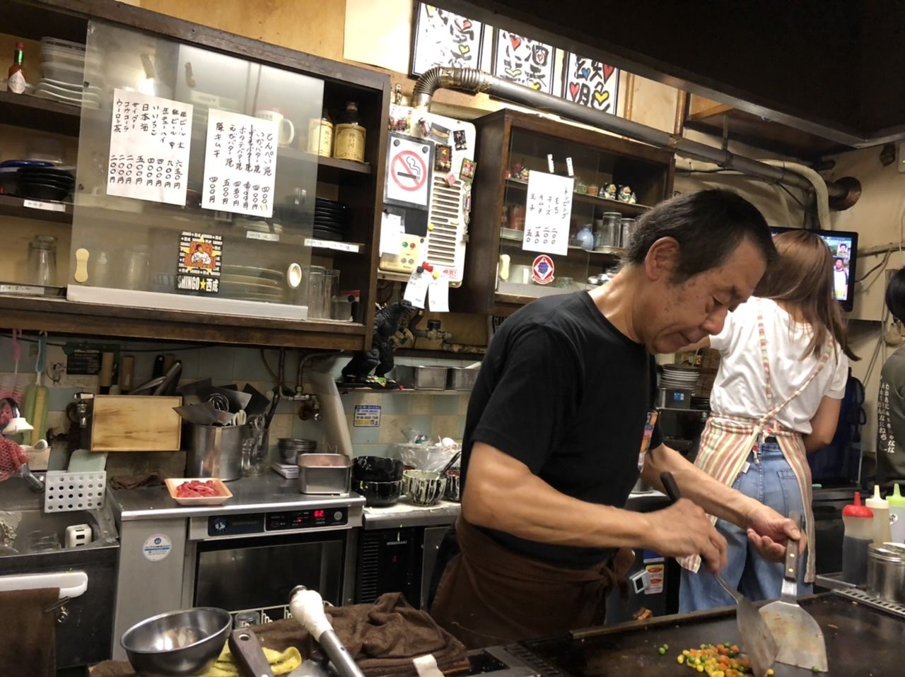 The owner of Okonomiyaki cooking